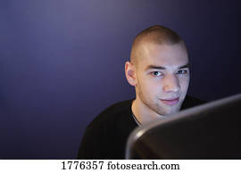 Casual man working overtime