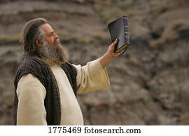 Man holding up Bible