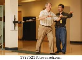 Occupational therapist working with a senior businessman