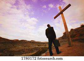 Businessman comes to cross