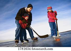 família, jogando hockey