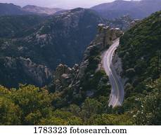 Highway winds through a rugged landscape