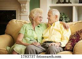 Senior couple sitting on the sofa together