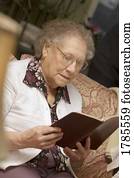 Elderly woman reading