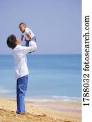 Father holding up child