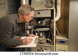 Man inspecting furnace