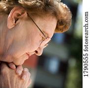 Senior woman praying