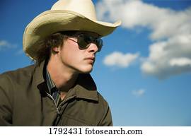 Pictures of Mid-adult man wearing sunglasses and cowboy hat u19636458 ...