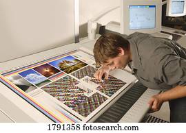 Man working with photographs