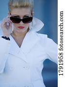 Woman looking over sunglasses