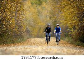 Man and woman biking