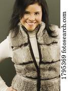 Woman with fur vest