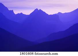 Hazy layered mountain scene  