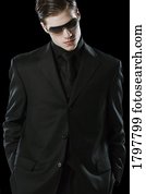 Man wearing a suit and sunglasses