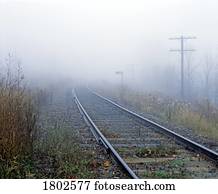 Railroad tracks in the fog