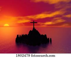 Sunset on a cross on rocks in the middle of a lake