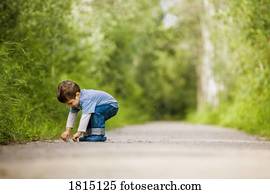Side view of boy on path