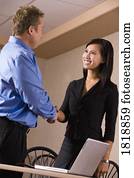 Man and woman shaking hands