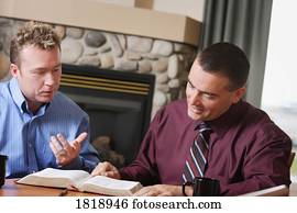 Two men studying Bible