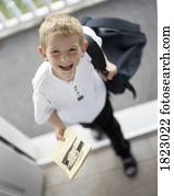 Boy coming home from school
