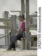 Woman sitting alone on a playground