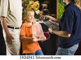 A boy holding a fish