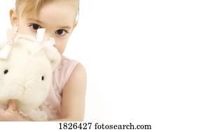 Girl holding a stuffed animal