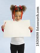 Girl holding up a book