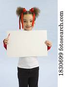 Girl holding up a book