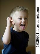 Little boy with his tongue sticking out