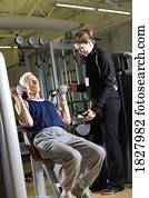 Man working out with trainer
