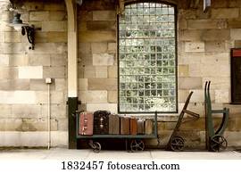 Suitcases On A Luggage Trolley In A Train Station