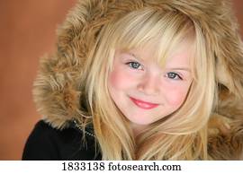 Young girl in brown fur hood