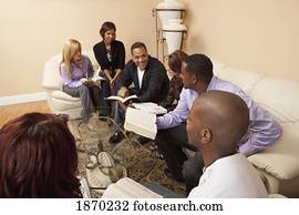a group of people in a bible study a group of people in a bible study
