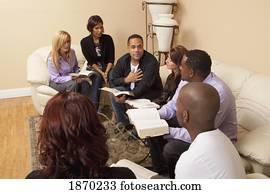 a group of people in a bible study a group of people in a bible study