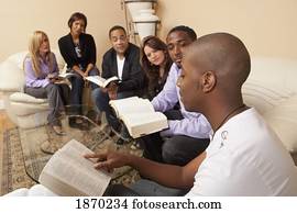 a group of people in a bible study a group of people in a bible study