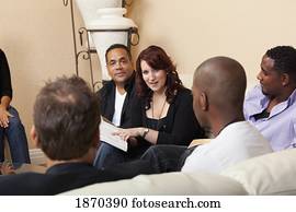 a group of adults in a home bible study