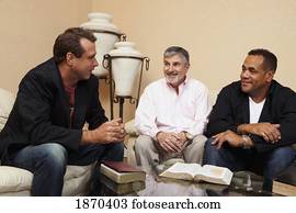 men in a home bible study
