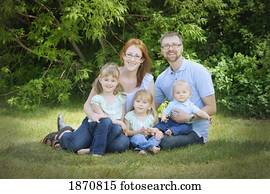 portrait of a family in the park portrait of a family in the park