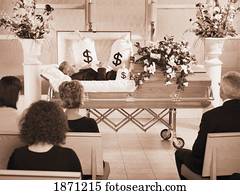 the deceased laying in a coffin at his funeral with bags of money surrounding him