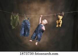 a baby on the clothesline