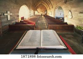 durham, england; an open bible at the back of a church durham, england; an open bible at the back of a church