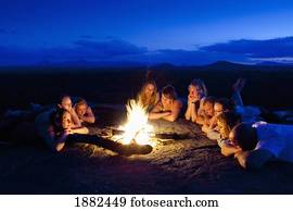 A Group Of People Laying By A Campfire; Manica, Mozambique, Africa A Group Of People Laying By A Campfire; Manica, Mozambique, Africa