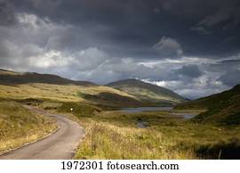 a road curving through a mountainous landscape; arnamurchan argyl scotland