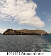 santiago island and a boat in the ocean; galapagos, equador