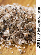 Close up of rock salt on a wooden cutting board; calgary, alberta, canada