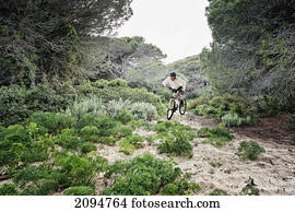 Cycling over rugged terrain; tarifa, cadiz, andalusia, spain
