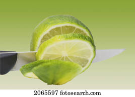 A Knife Cutting A Lime