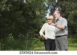 A senior couple in a park; Stony Plain, Alberta, Canada