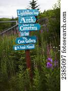Landmark sign surrounded by wildflowers in Halibut Cove; Kachemak Bay, Alaska, United States of America